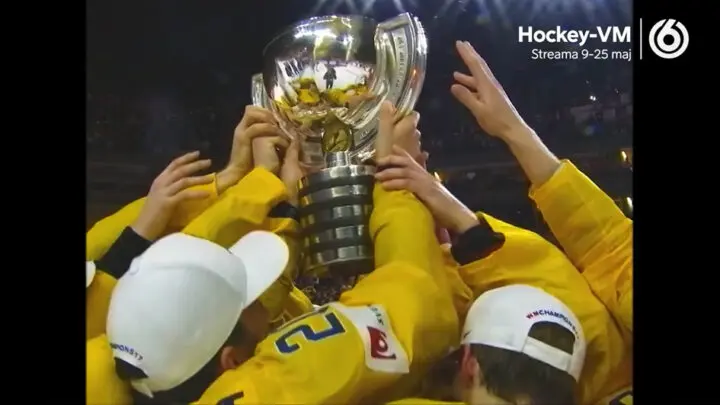 Article image: Hockey players in yellow jerseys holding up a trophy.