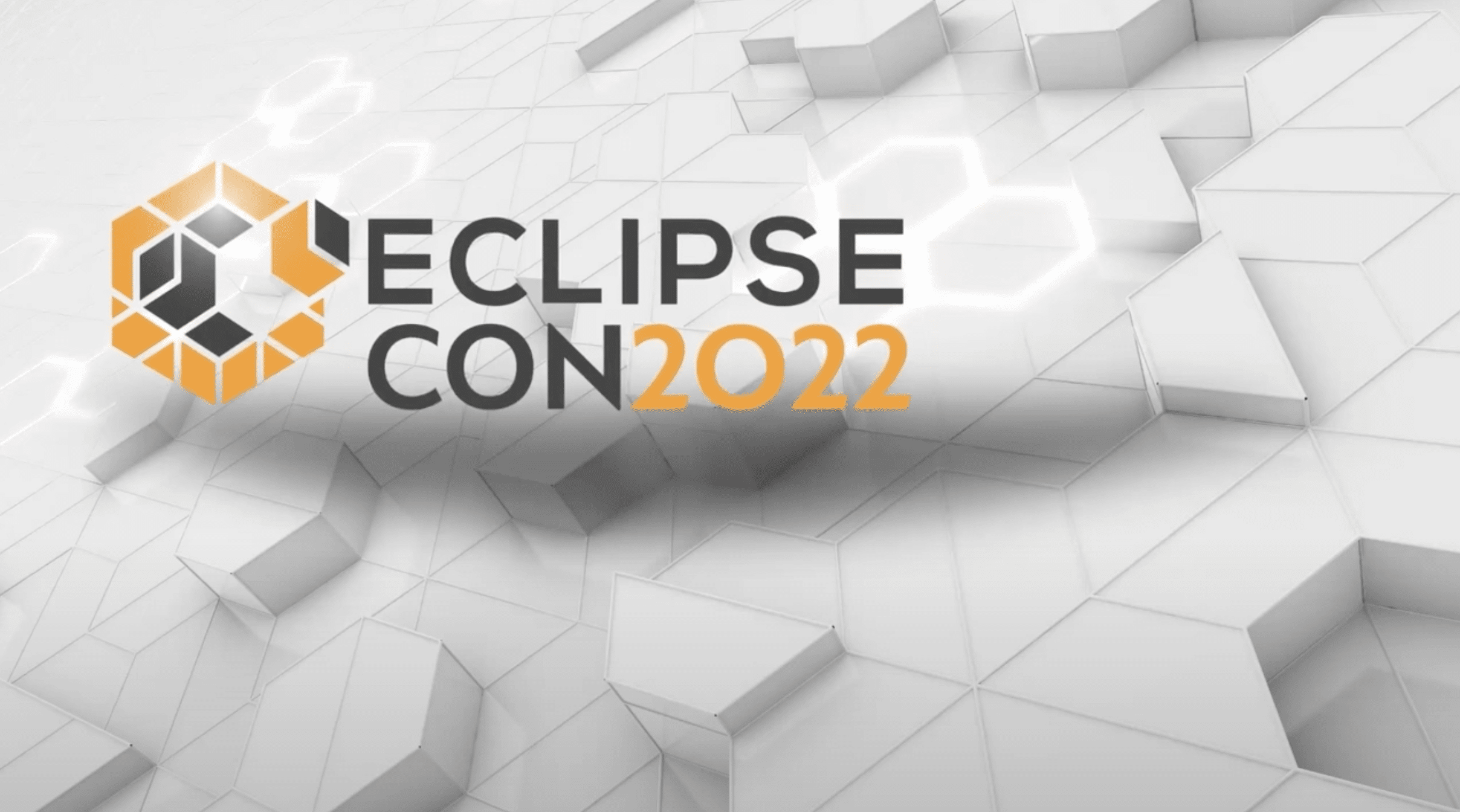 Texten "EclipseCon 2022" med geometriskt mönster och hexagoner i bakgrunden.
