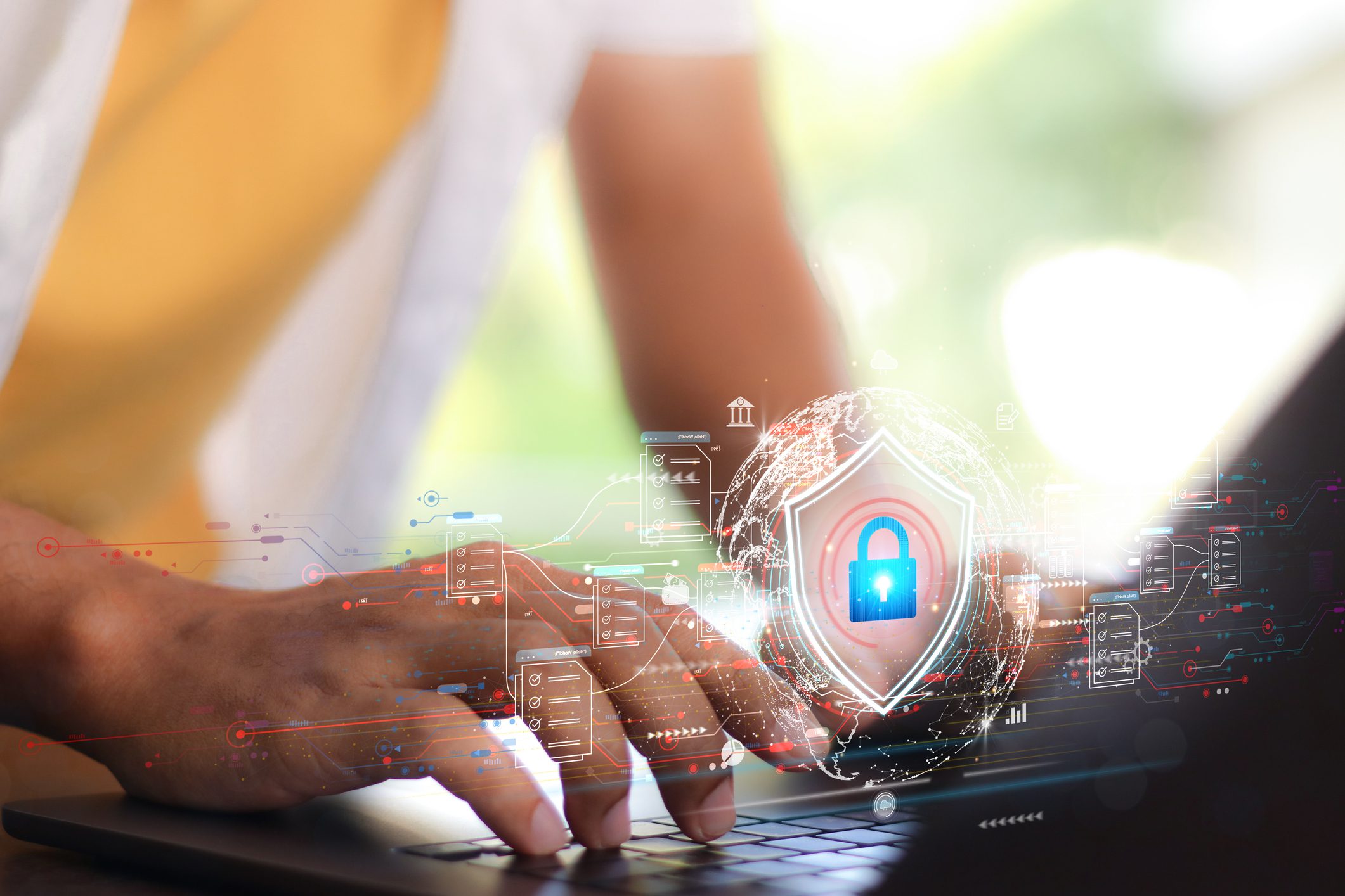 Hands on a keyboard and a padlock icon.