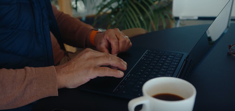Close-up of hands typing on a keyboard