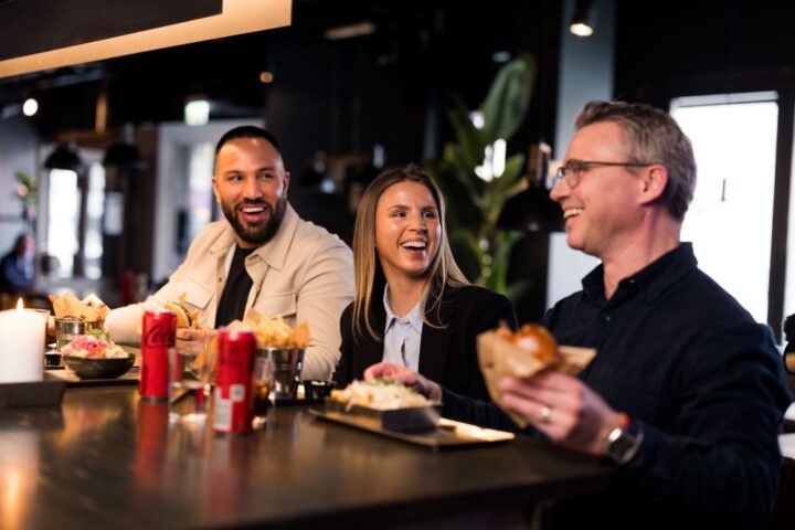 Happy people at a bar counter