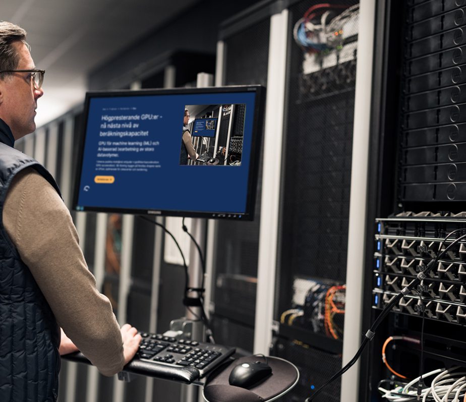 IT technician working at a computer in Bineros' server hall