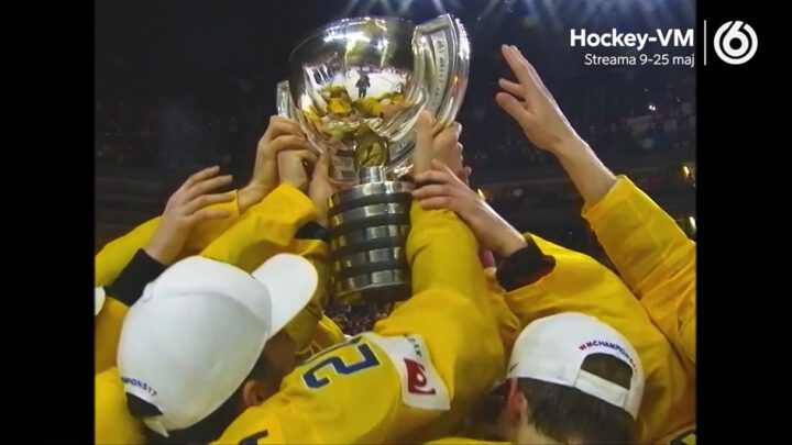 Article image: Hockey players in yellow jerseys holding up a trophy.