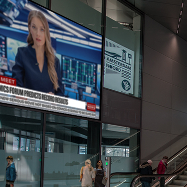 Large screen TV in room with escalators