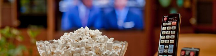 Remote control and a bowl of popcorn